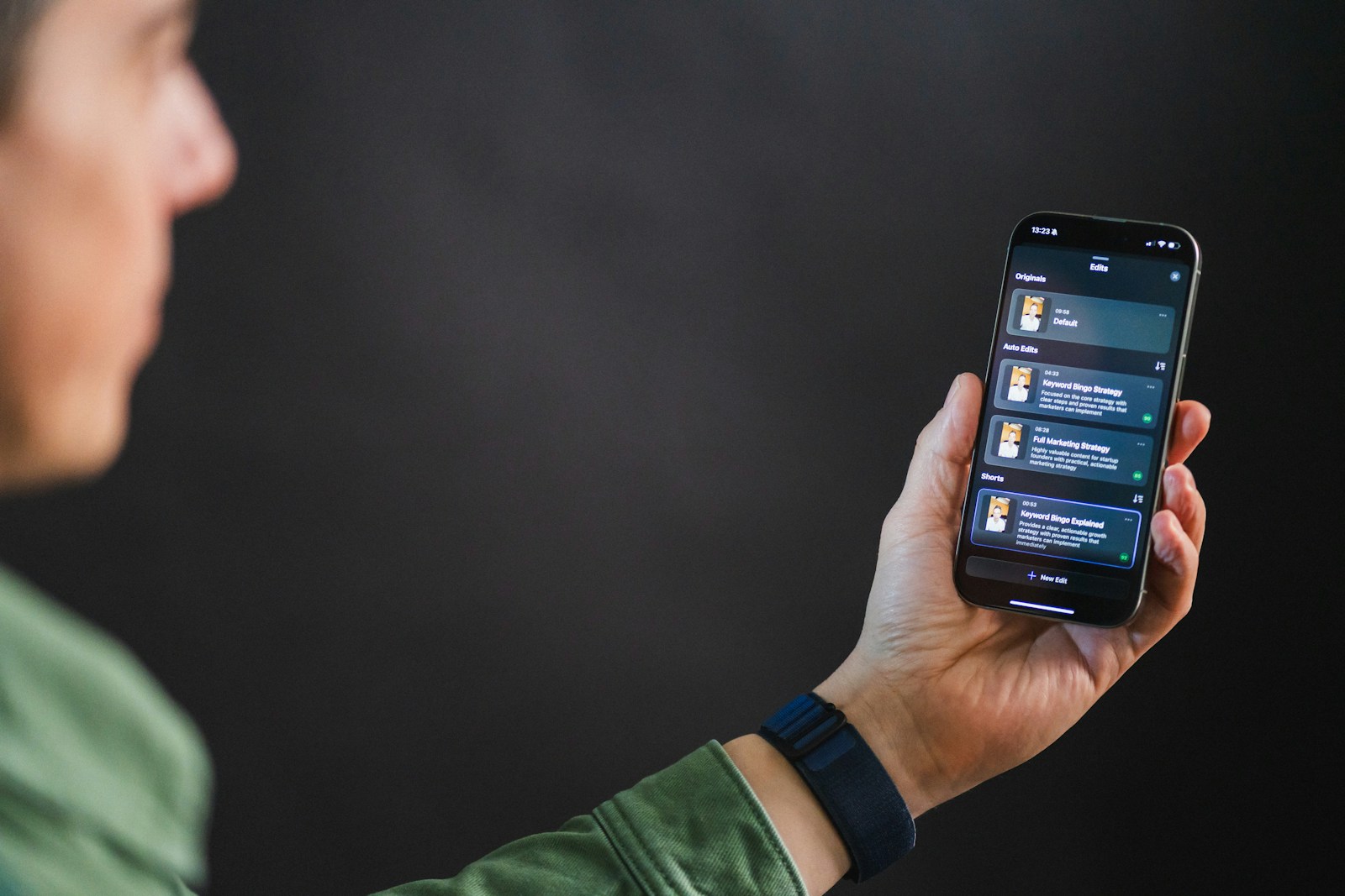 Man holding smartphone with app interface